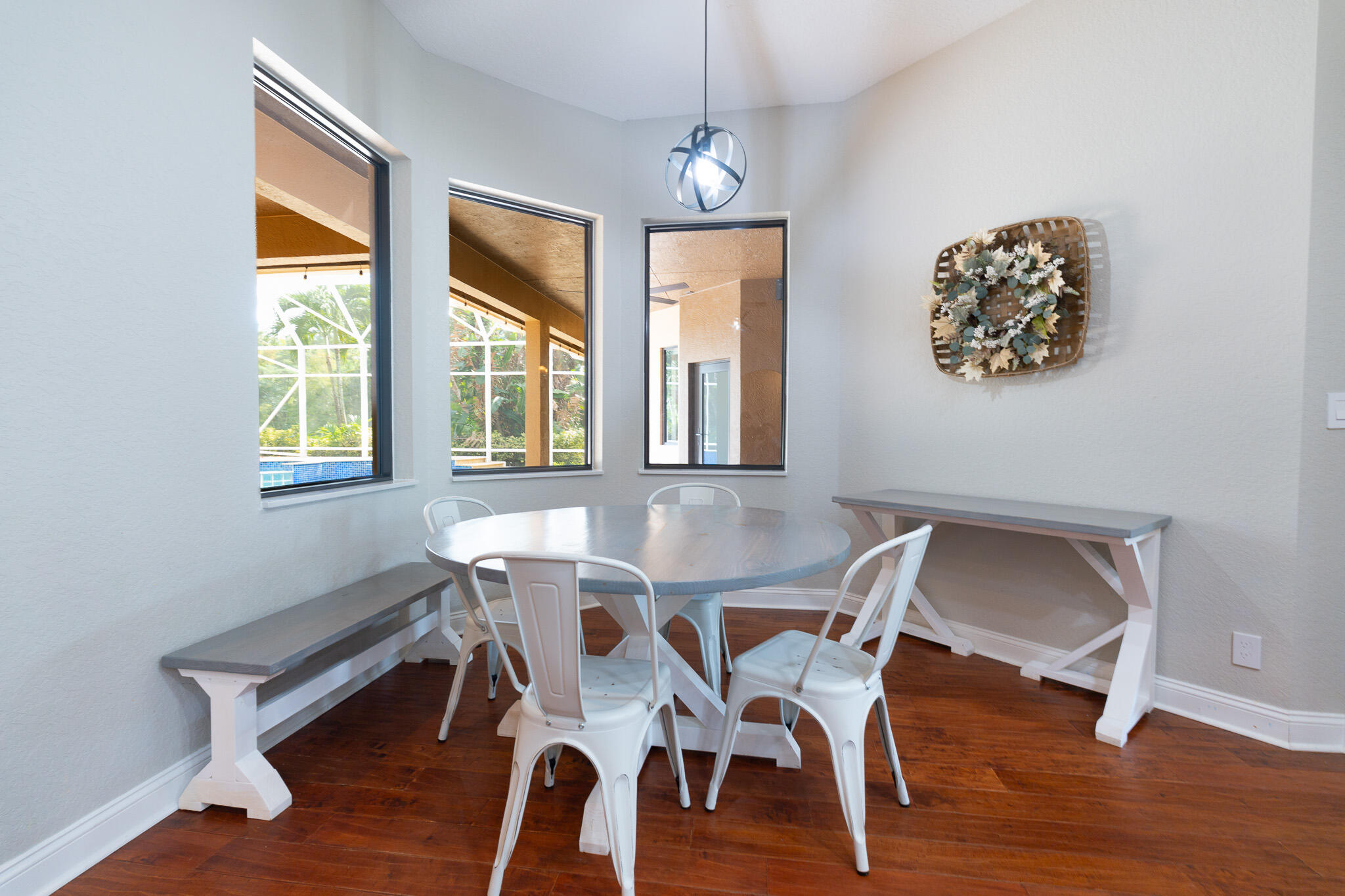 3516 185th Trail Loxahatchee, FL 33470 - Photo 16 of 56 a view of a dining room with furniture window and wooden floor