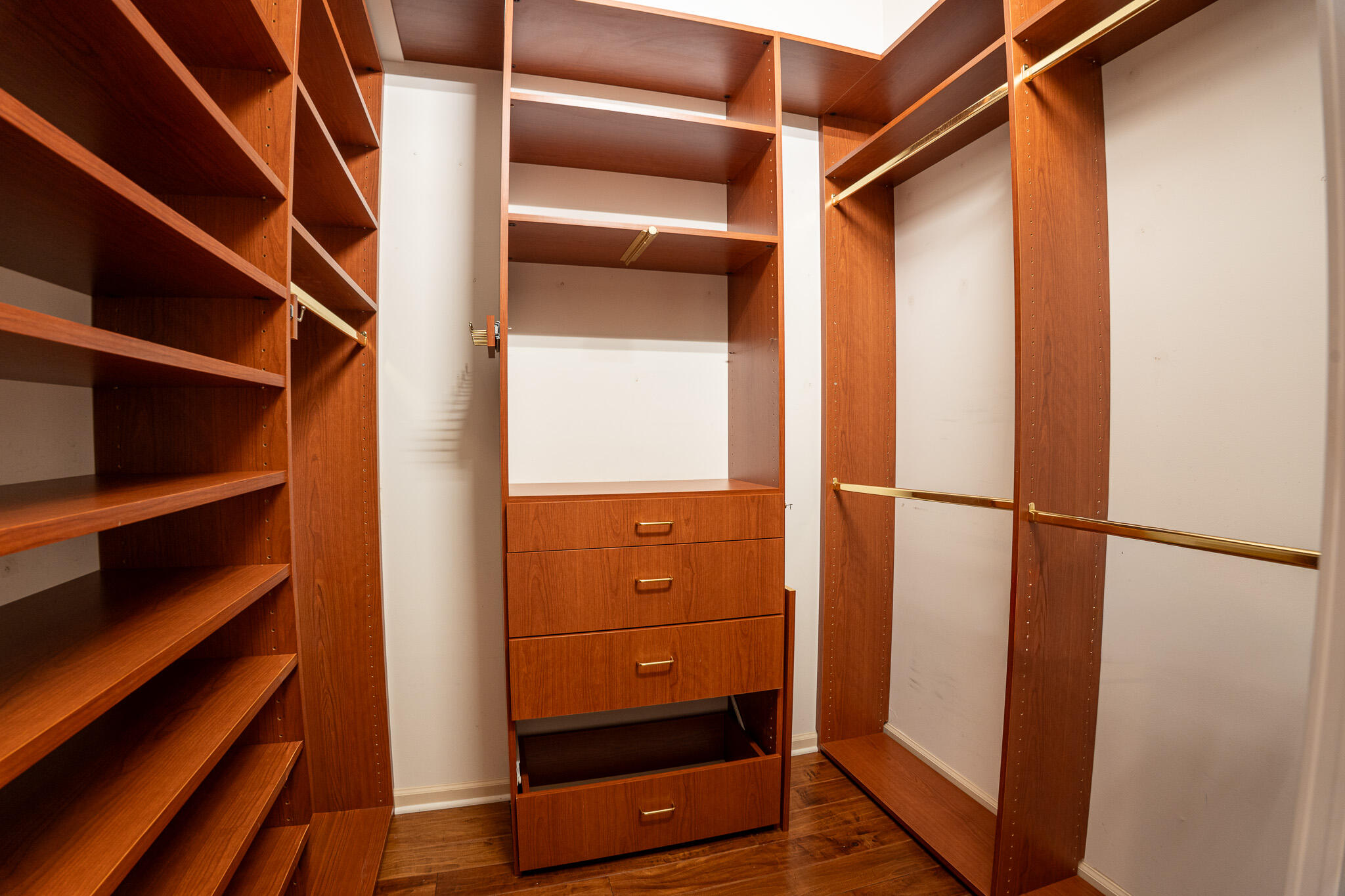 3516 185th Trail Loxahatchee, FL 33470 - Photo 25 of 56 a view of walk in closet with empty racks
