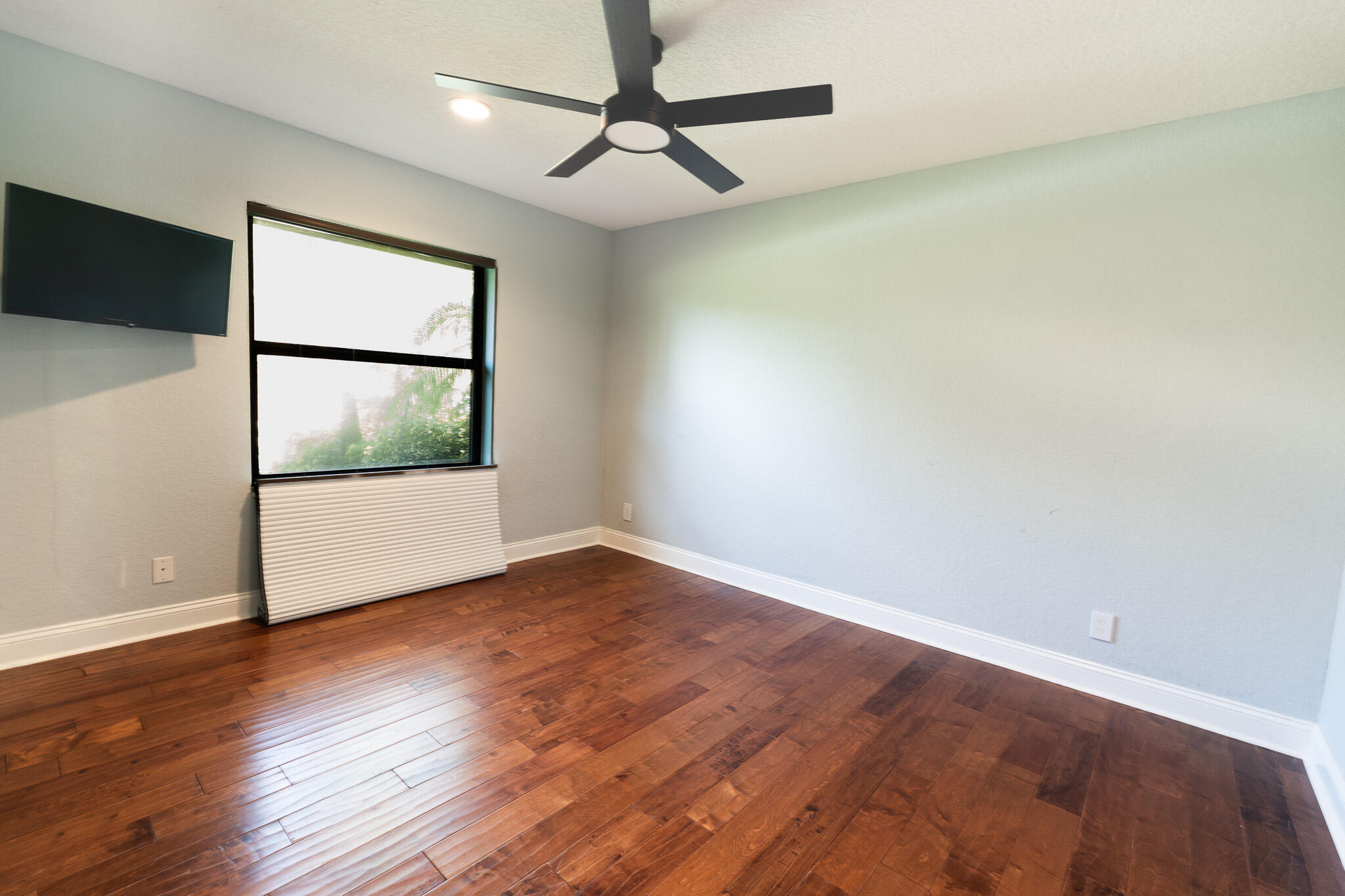 3516 185th Trail Loxahatchee, FL 33470 - Photo 26 of 56 a view of an empty room with wooden floor and a window