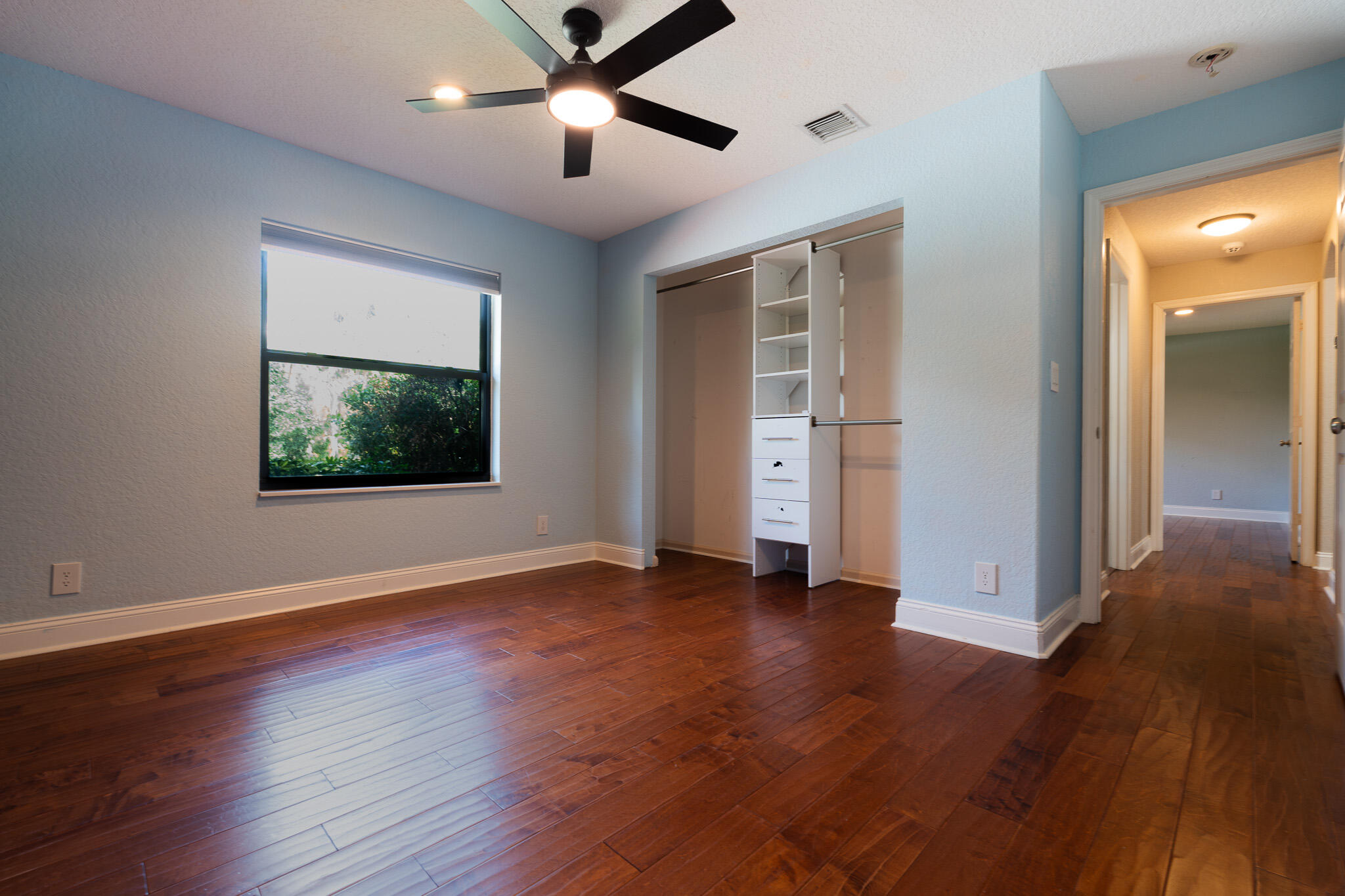 3516 185th Trail Loxahatchee, FL 33470 - Photo 30 of 56 a view of an empty room with wooden floor and a window
