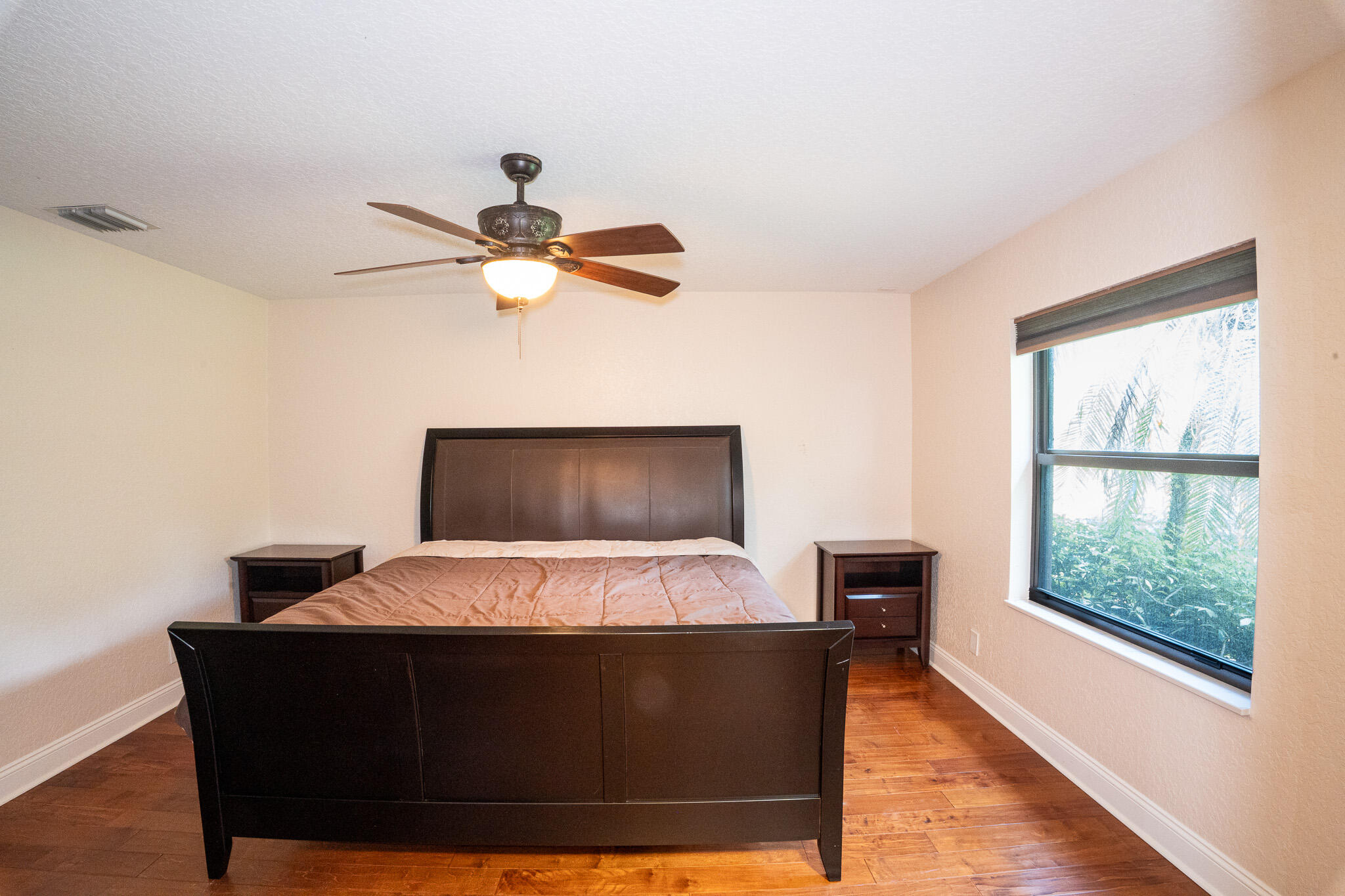 3516 185th Trail Loxahatchee, FL 33470 - Photo 33 of 56 a living room with a bed furniture and a large window