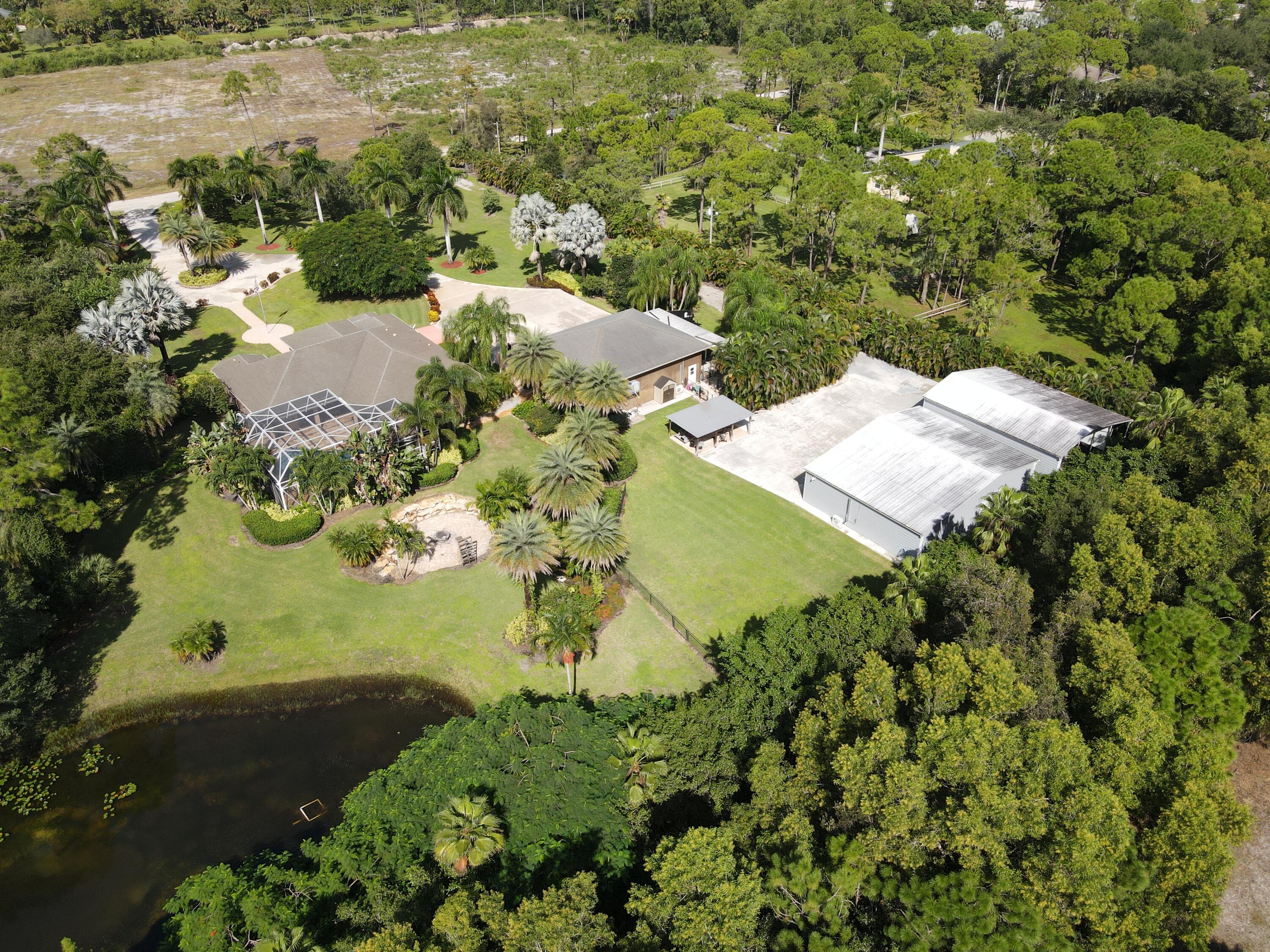 3516 185th Trail Loxahatchee, FL 33470 - Photo 4 of 56 an aerial view of a residential houses with outdoor space
