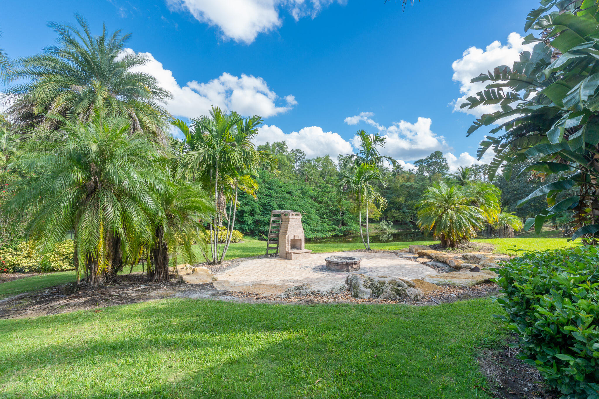 3516 185th Trail Loxahatchee, FL 33470 - Photo 44 of 56 a view of a garden with a tree