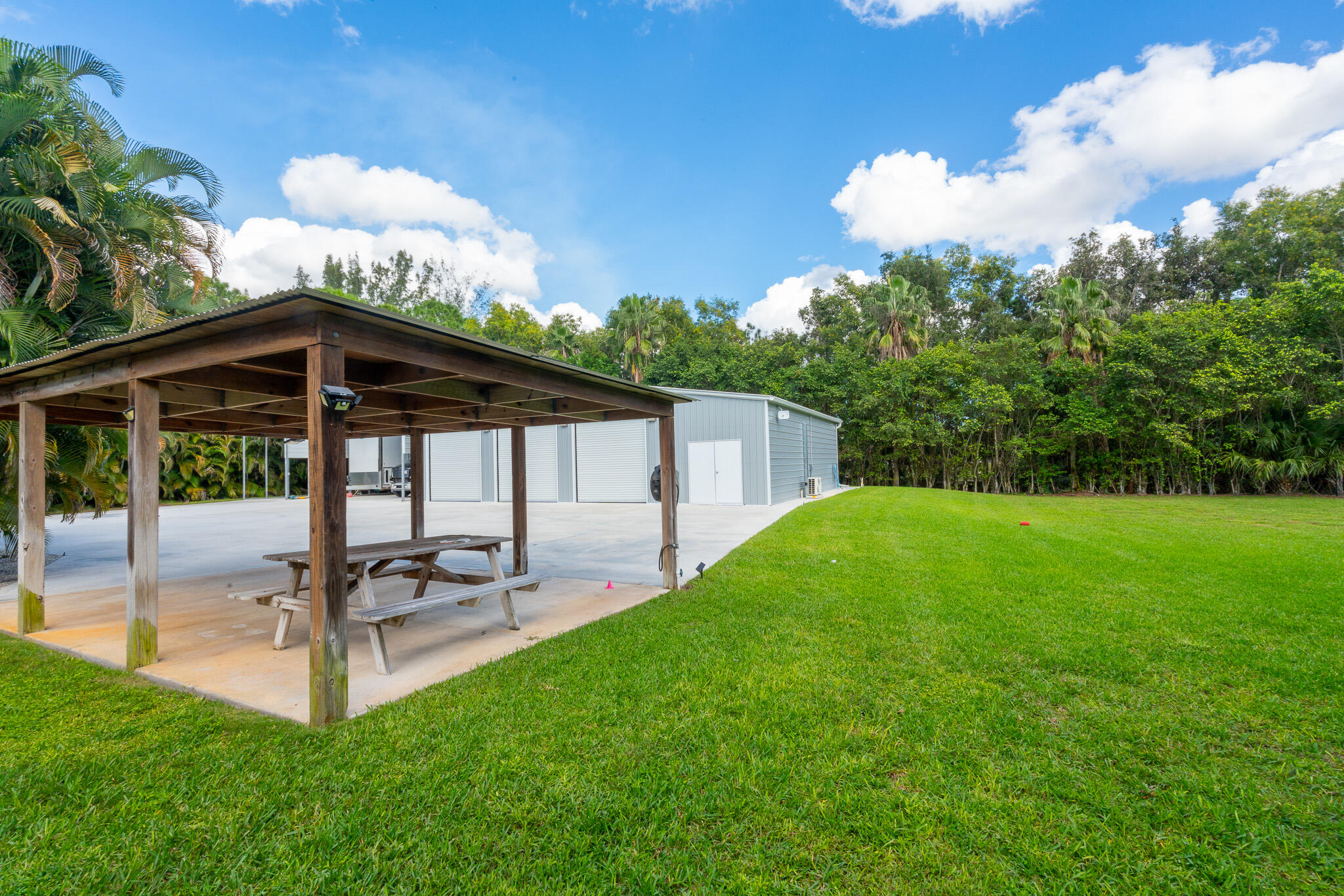 3516 185th Trail Loxahatchee, FL 33470 - Photo 47 of 56 a view of a backyard with sitting area