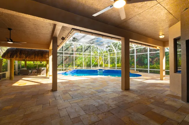 a outdoor living space with patio furniture and wooden floor