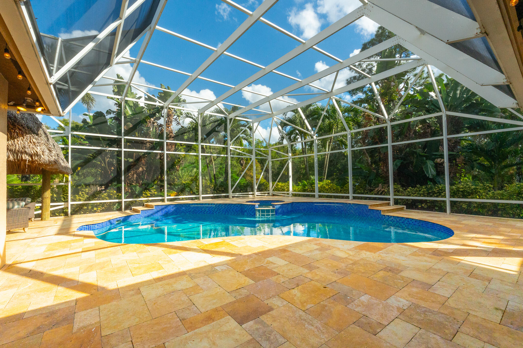 3516 185th Trail Loxahatchee, FL 33470 - Photo 51 of 56 a view of indoor pool and deck in the backyard