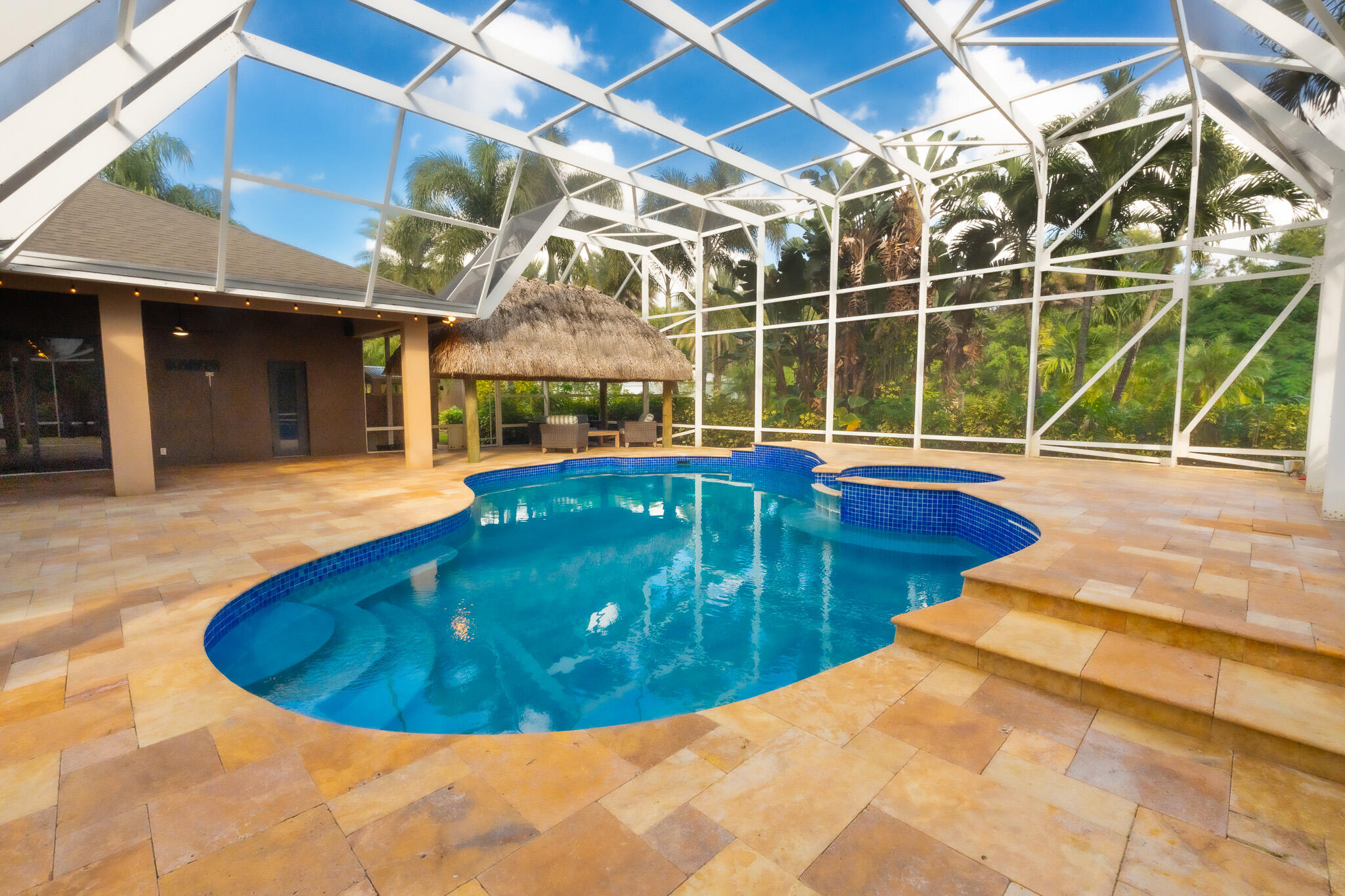 3516 185th Trail Loxahatchee, FL 33470 - Photo 55 of 56 a view of a swimming pool with a patio