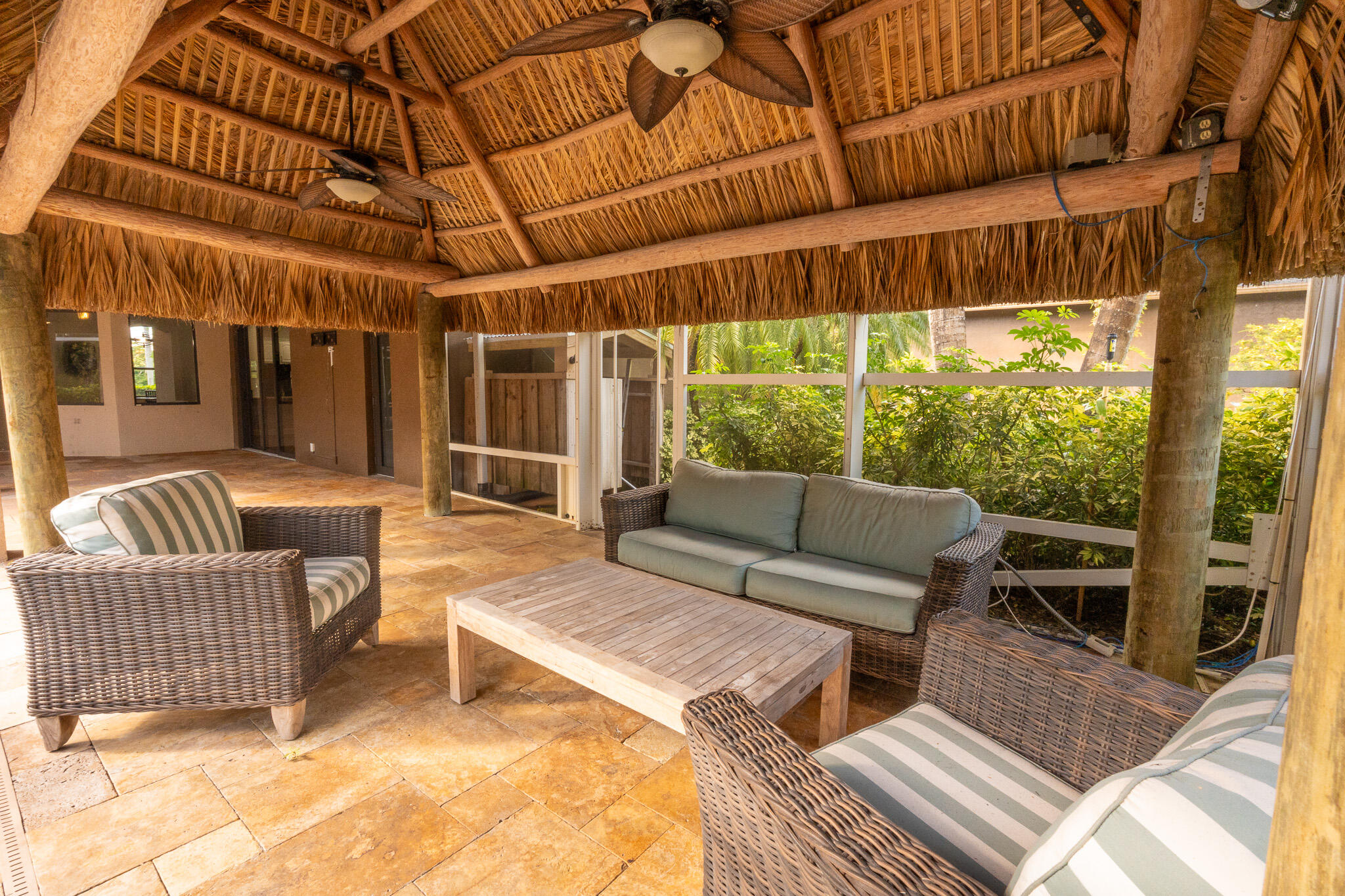 3516 185th Trail Loxahatchee, FL 33470 - Photo 56 of 56 a outdoor living space with patio furniture and wooden floor