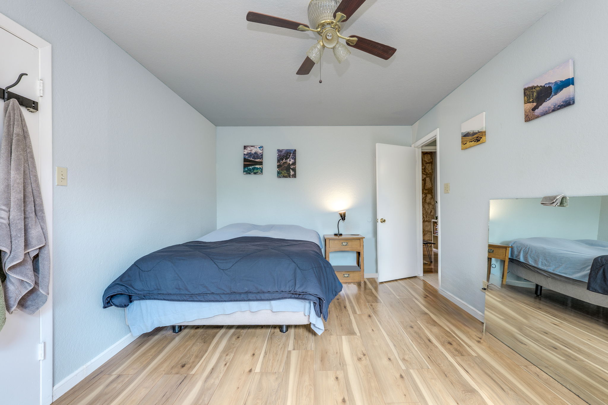 4307 South 1st Street, Unit 101 Austin, TX 78745 - Photo 23 of 33 a bedroom with a bed and wooden floor