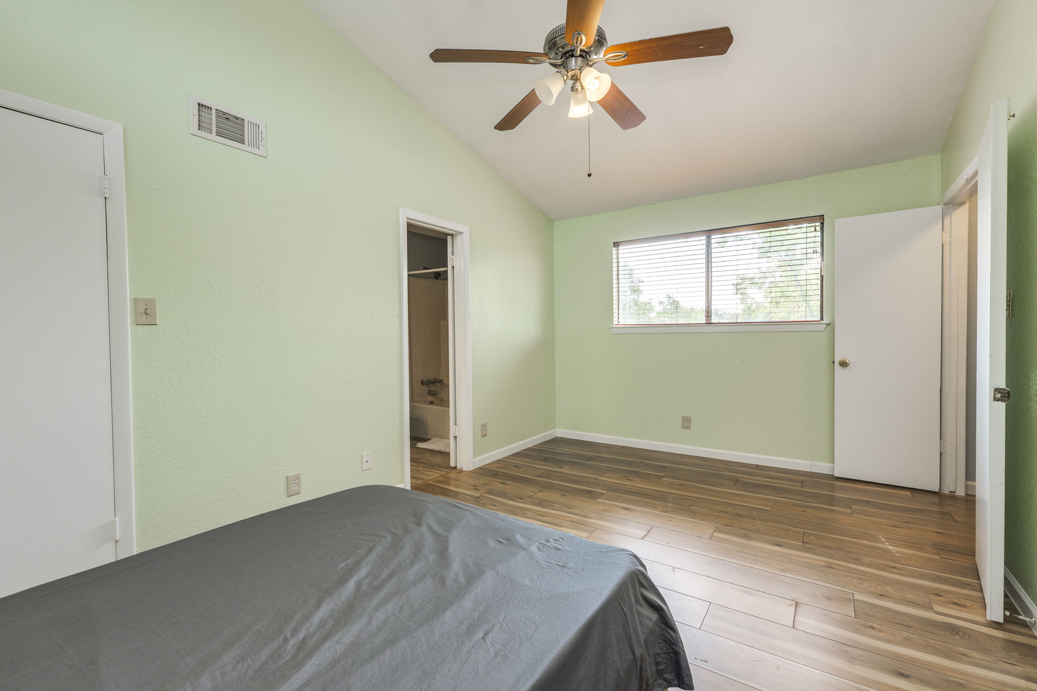 4307 South 1st Street, Unit 101 Austin, TX 78745 - Photo 25 of 33 an empty room with wooden floor fan and windows