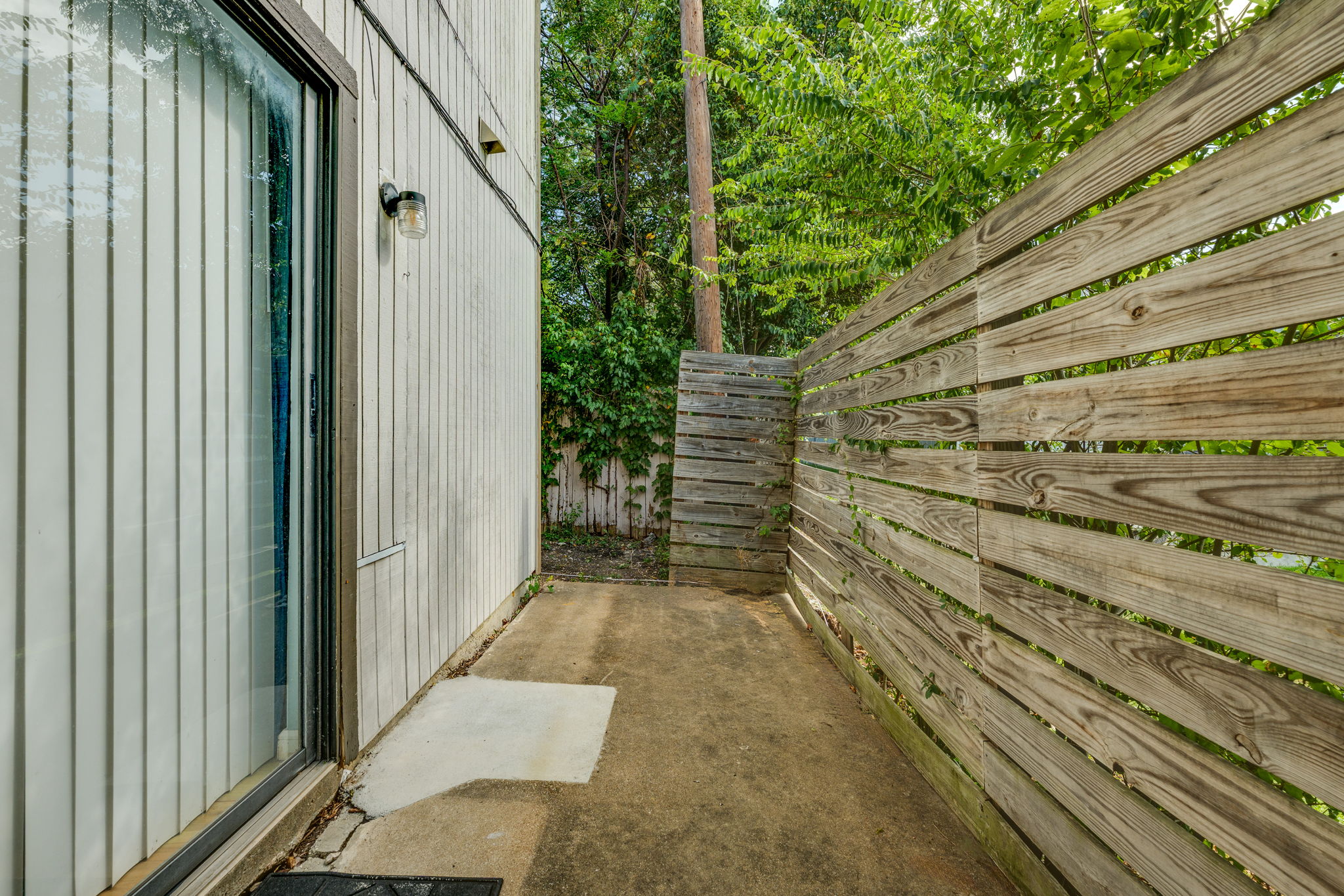 4307 South 1st Street, Unit 101 Austin, TX 78745 - Photo 29 of 33 a view of a pathway of a building with wooden fence