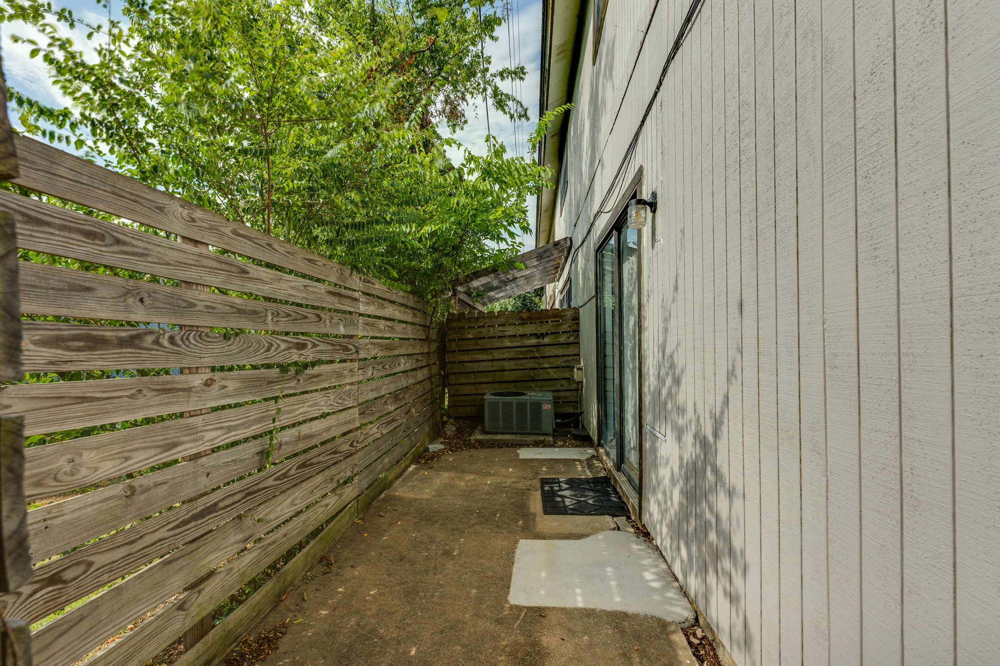 4307 South 1st Street, Unit 101 Austin, TX 78745 - Photo 31 of 33 a view of small backyard with stairs and wooden fence