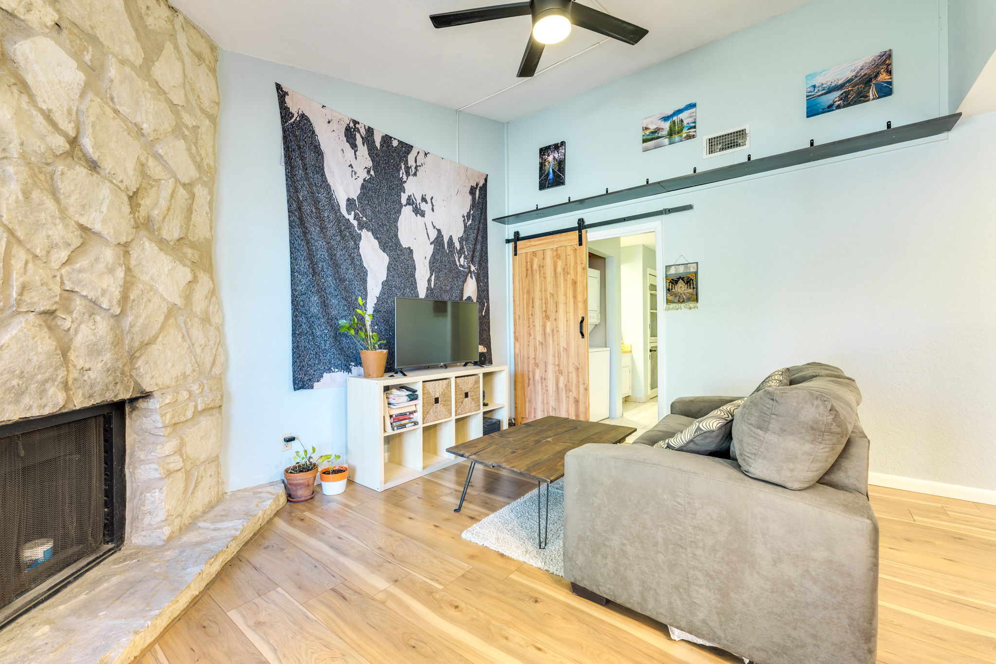 4307 South 1st Street, Unit 101 Austin, TX 78745 - Photo 4 of 33 a bedroom with a bed and a fireplace