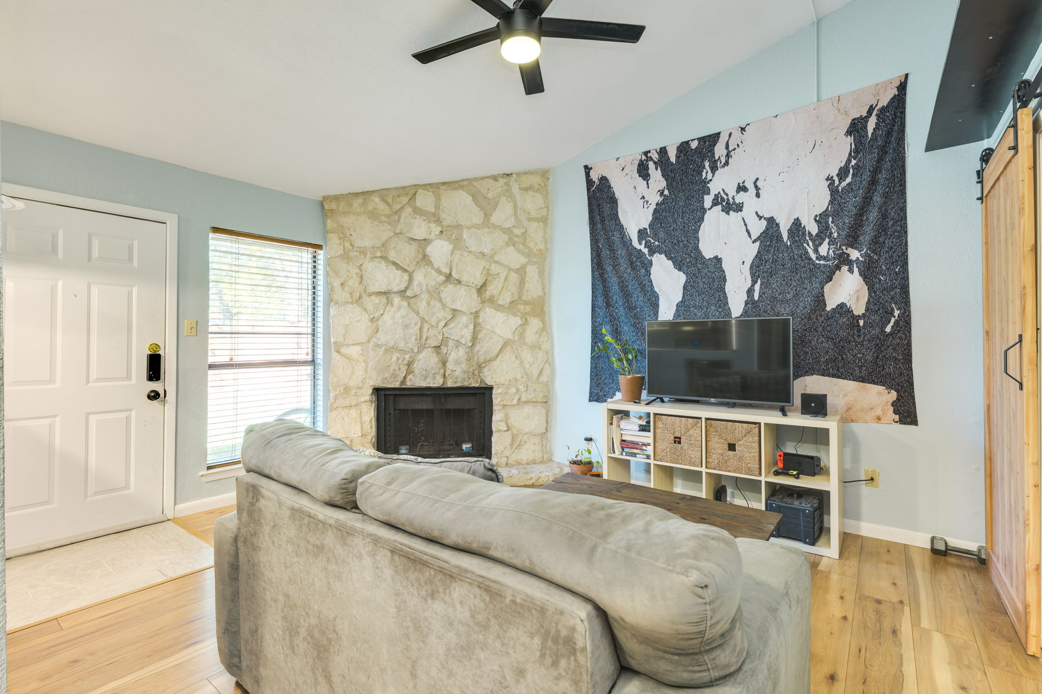 4307 South 1st Street, Unit 101 Austin, TX 78745 - Photo 5 of 33 a living room with furniture and a fireplace