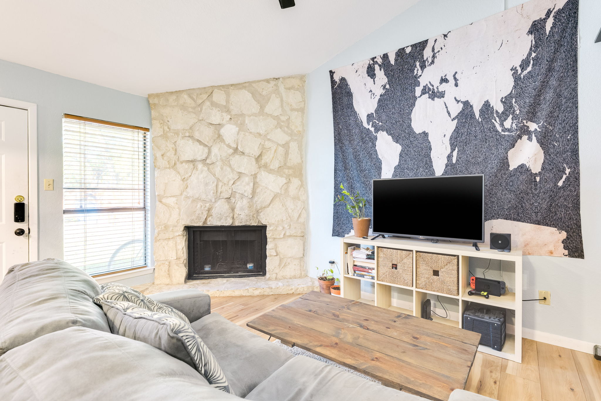 4307 South 1st Street, Unit 101 Austin, TX 78745 - Photo 7 of 33 a living room with a flat screen tv and a fireplace