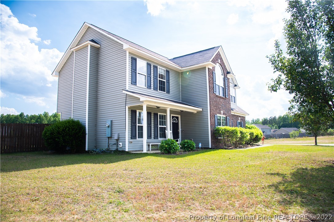 125 Cape Fear Road Raeford, NC 28376 - Photo 1 of 46 a front view of a house with garden