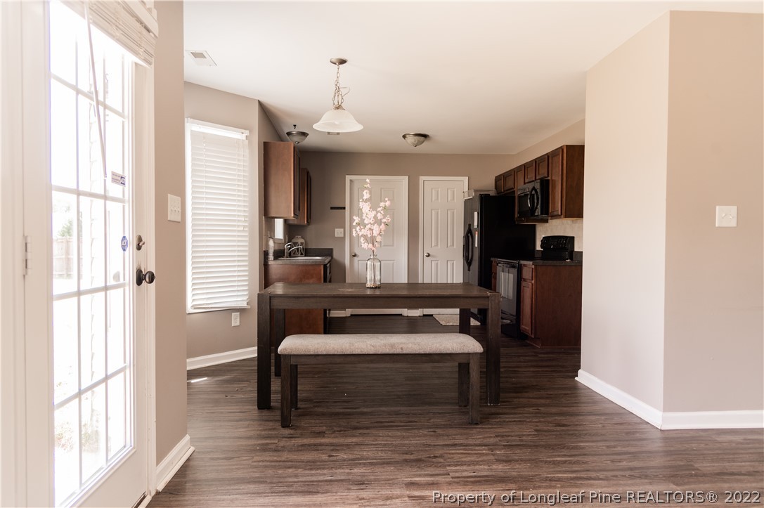 125 Cape Fear Road Raeford, NC 28376 - Photo 11 of 46 a view of a hallway with wooden floor and a large window
