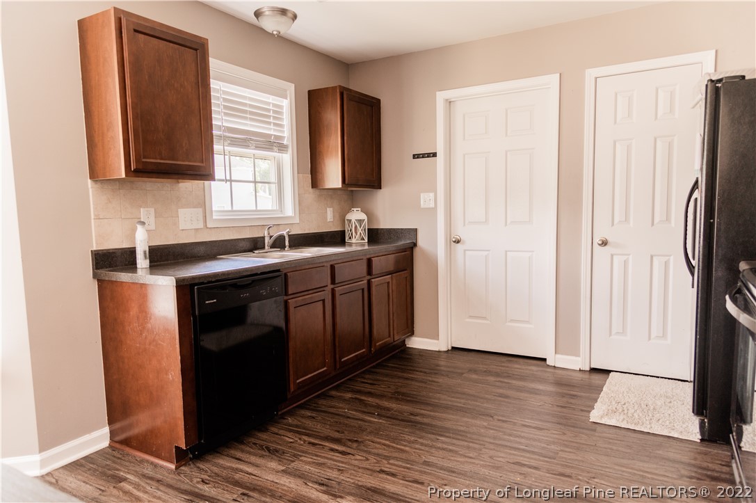 125 Cape Fear Road Raeford, NC 28376 - Photo 13 of 46 a kitchen with stainless steel appliances a sink stove and refrigerator
