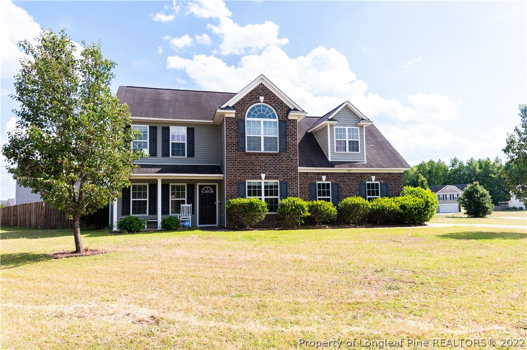 125 Cape Fear Road Raeford, NC 28376 - Photo 2 of 46 a front view of a house with a yard