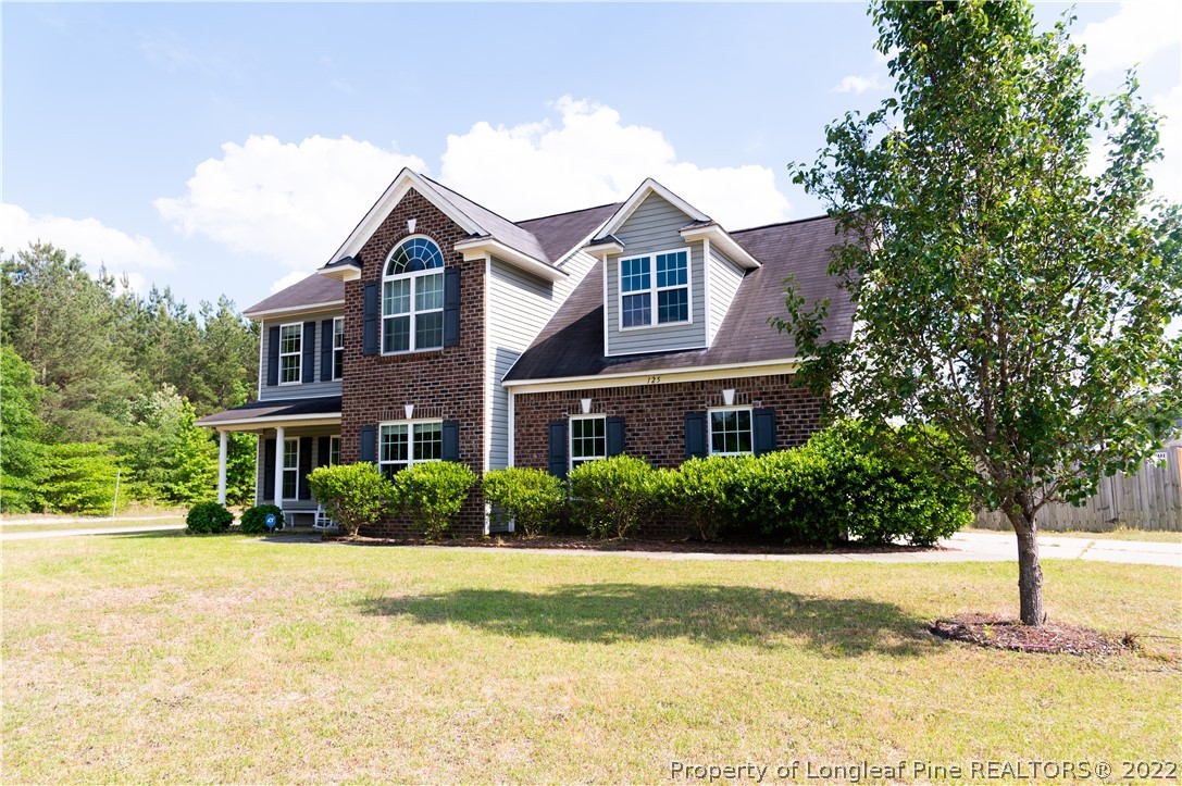 125 Cape Fear Road Raeford, NC 28376 - Photo 3 of 46 a front view of a house with a yard