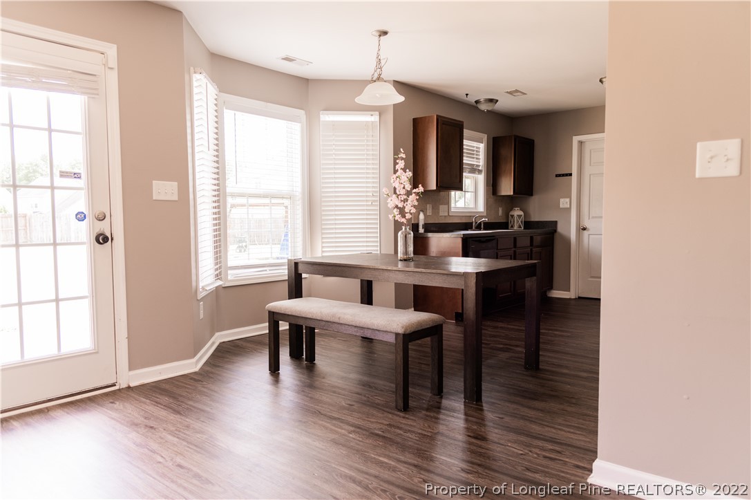 125 Cape Fear Road Raeford, NC 28376 - Photo 10 of 46 a dining room with wooden floor and breakfast area
