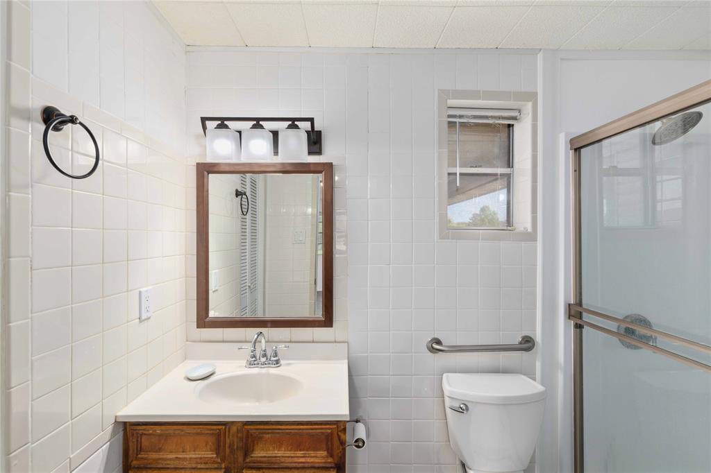100 County Road 319 Early, TX 76802 - Photo 16 of 39 a bathroom with a sink toilet and vanity