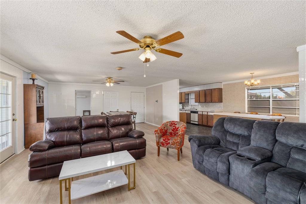 100 County Road 319 Early, TX 76802 - Photo 6 of 39 a living room with furniture a ceiling fan and a window