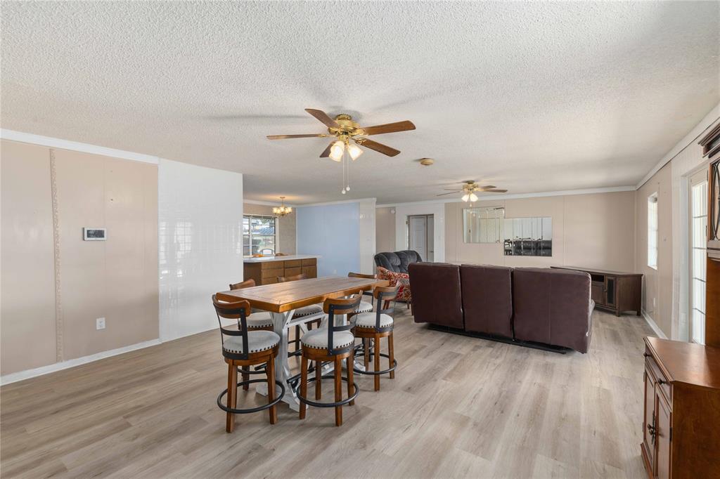 100 County Road 319 Early, TX 76802 - Photo 10 of 39 a living room with furniture and wooden floor
