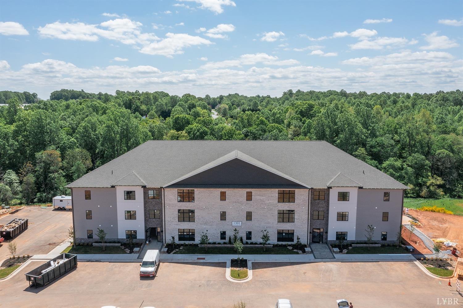 1300 Stoney Ridge Boulevard, Unit 101 Forest, VA 24551 - Photo 13 of 18 an aerial view of a house with swimming pool and furniture