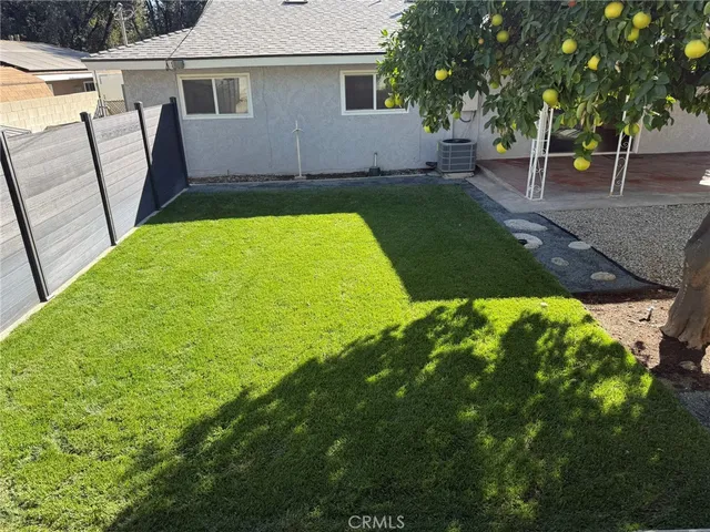a view of backyard with green space
