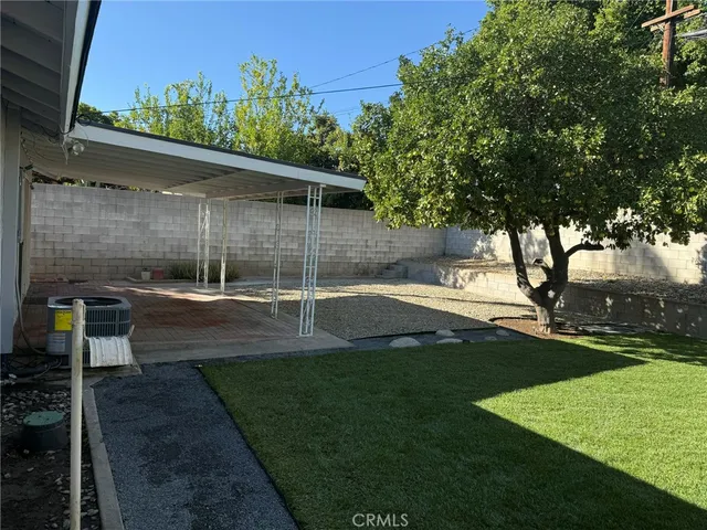 a view of yard with swimming pool