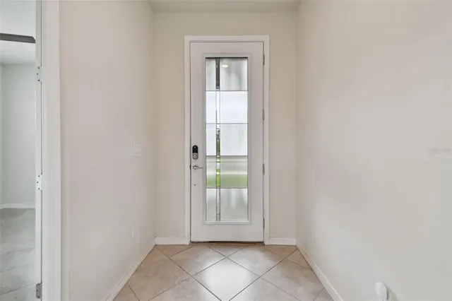 a kitchen with kitchen island granite countertop stainless steel appliances a sink a counter top space cabinets and a window