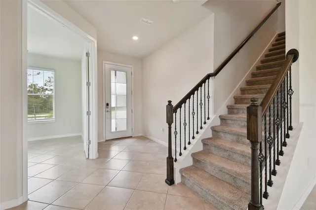 a kitchen with stainless steel appliances granite countertop a refrigerator and a stove