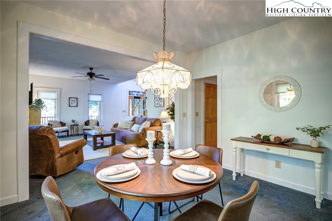 1267 Hopewell Church Road Boone, NC 28607 - Photo 18 of 50 a view of a dining room with furniture and chandelier
