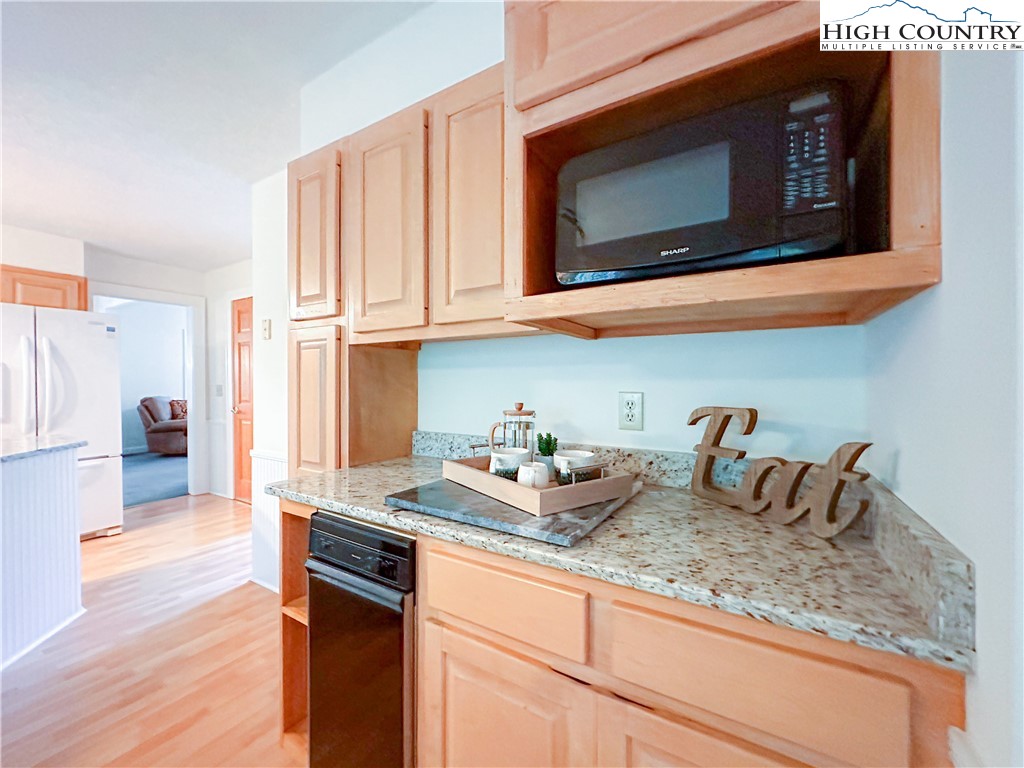 1267 Hopewell Church Road Boone, NC 28607 - Photo 23 of 50 a kitchen with stainless steel appliances granite countertop a sink and cabinets
