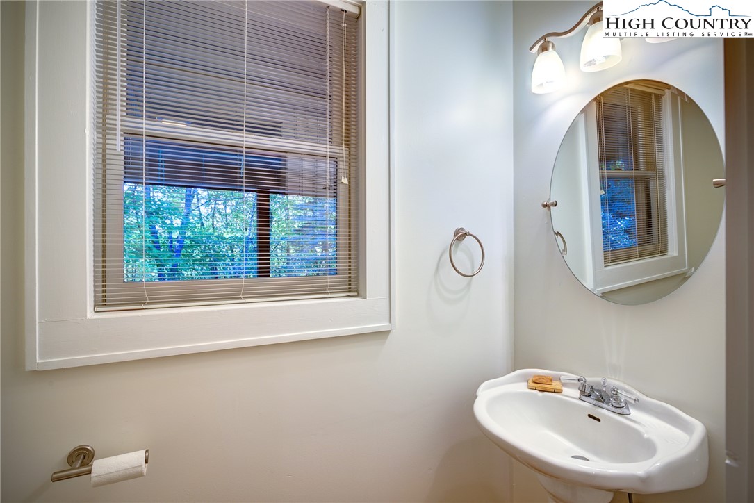 1267 Hopewell Church Road Boone, NC 28607 - Photo 24 of 50 a bathroom with a sink and a mirror
