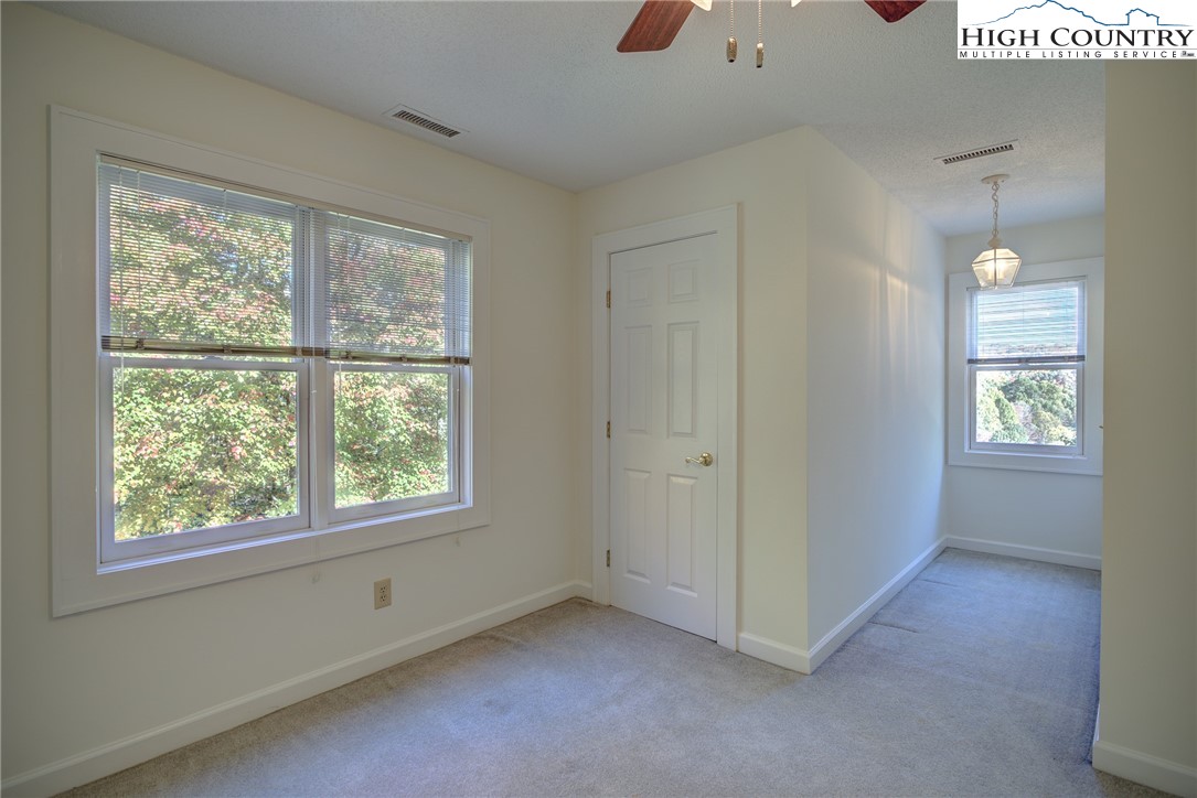1267 Hopewell Church Road Boone, NC 28607 - Photo 34 of 50 an empty room with windows