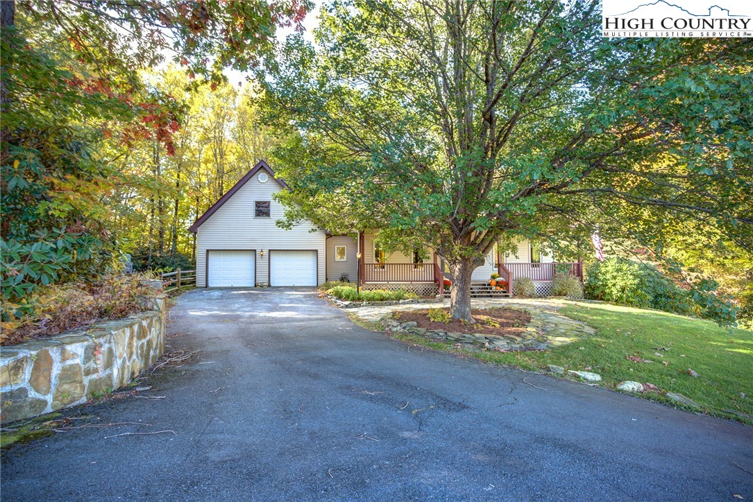 1267 Hopewell Church Road Boone, NC 28607 - Photo 4 of 50 a front view of a house with yard and trees