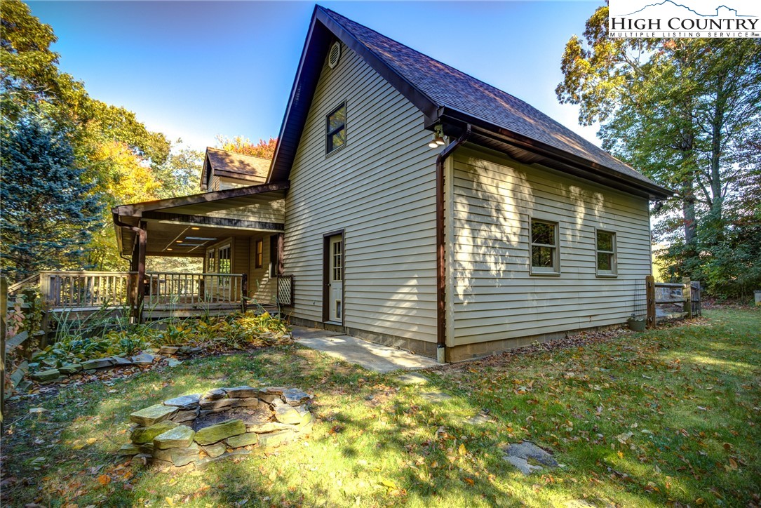1267 Hopewell Church Road Boone, NC 28607 - Photo 42 of 50 a view of house with backyard and trees