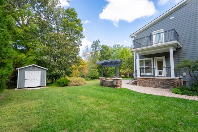 a front view of a house with garden and porch