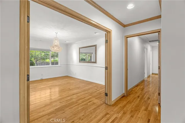 a bathroom with a granite countertop sink a mirror and shower