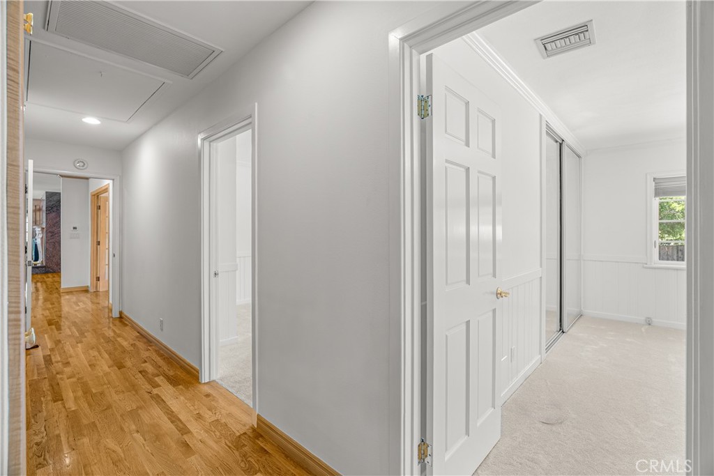 591 Busch Place Pasadena, CA 91105 - Photo 16 of 64 a view of a hallway with wooden floor