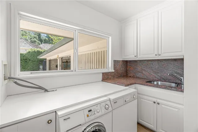 a living room with dining table a table and chairs with wooden floor