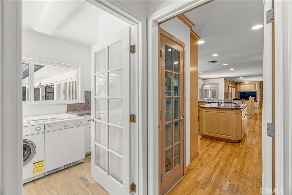 591 Busch Place Pasadena, CA 91105 - Photo 25 of 64 a view of a kitchen cabinets and wooden floor
