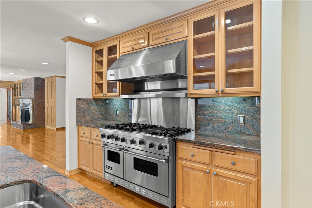 591 Busch Place Pasadena, CA 91105 - Photo 27 of 64 a stove top oven sitting inside of a kitchen