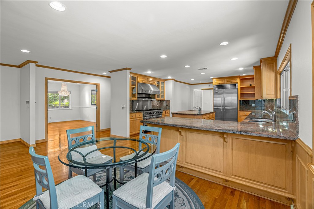 591 Busch Place Pasadena, CA 91105 - Photo 33 of 64 a kitchen with stainless steel appliances granite countertop a sink and a refrigerator