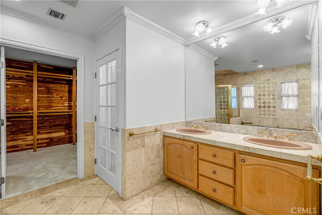 591 Busch Place Pasadena, CA 91105 - Photo 44 of 64 a bathroom with a granite countertop sink mirror and