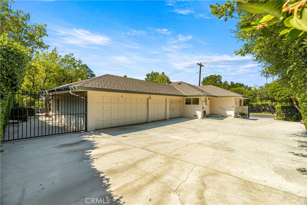 591 Busch Place Pasadena, CA 91105 - Photo 58 of 64 a front view of a house with a yard and garage