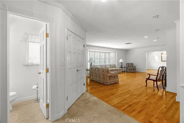 a spacious bedroom with a bed and a couch