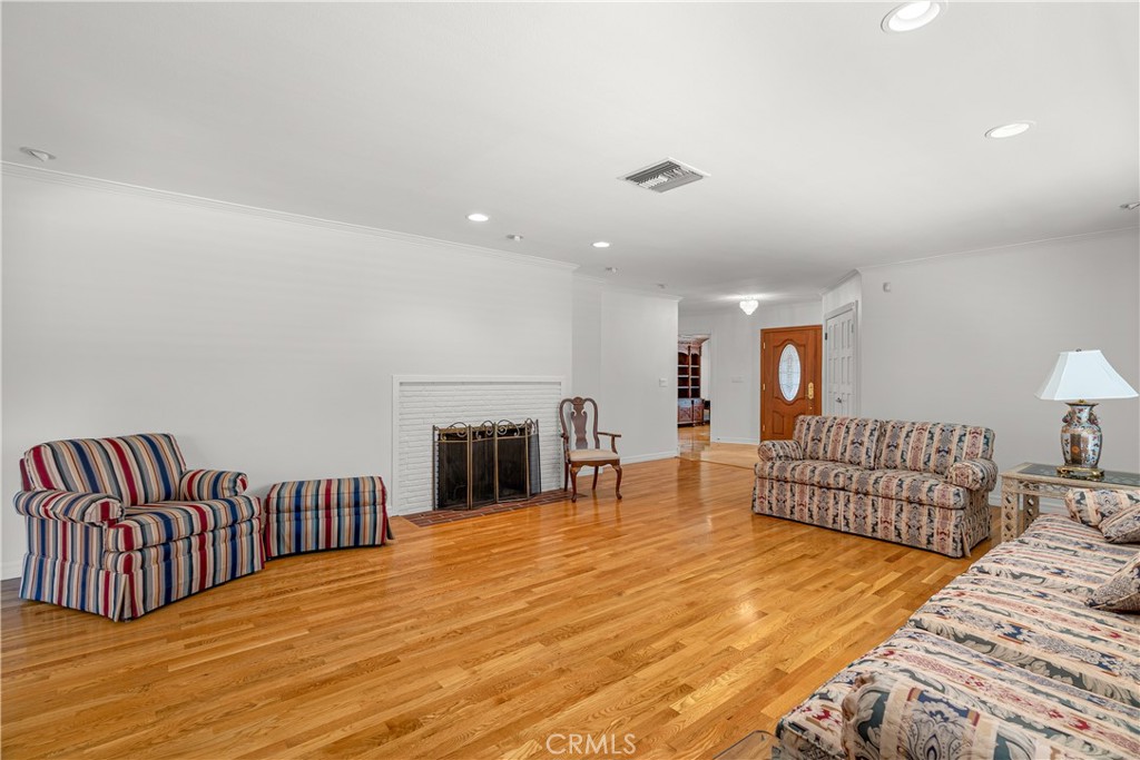591 Busch Place Pasadena, CA 91105 - Photo 10 of 64 a spacious bedroom with a bed and a couch